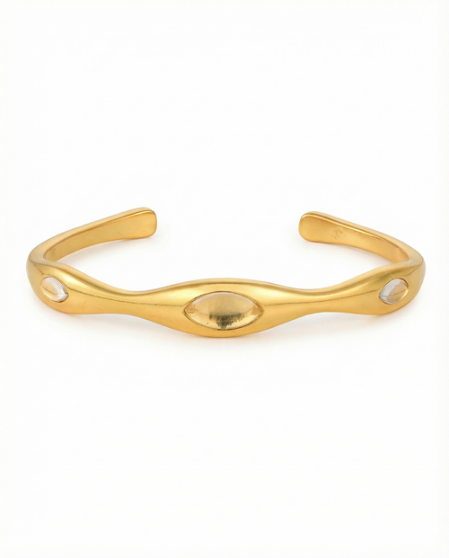 Gold bracelet on a white background selenova