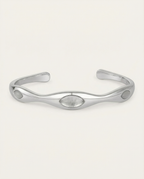 Silver bracelet on a light gray background