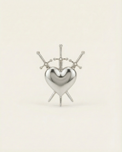 Silver heart-shaped ring with 3 swords design on a beige background